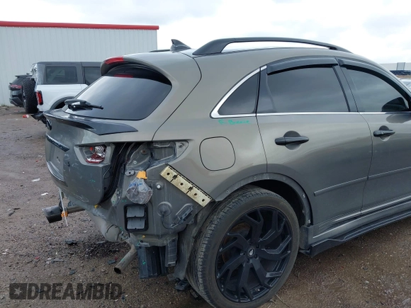2014 Infiniti QX70 z VIN JN8CS1MU3EM451745, wystawiony jako IAAI lot #42203922 z przebiegiem 144 990 mil mil oraz . Historia ofert i sprzedaży dostępna na DreamBid. Obrazek 6.