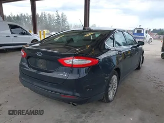2016 Ford Fusion SE Hybrid with VIN 3FA6P0LU1GR106980, listed as a IAAI auction lot 41895379 with 200,226 mi miles. Bid and sale history available at carsss.com. Image 4.
