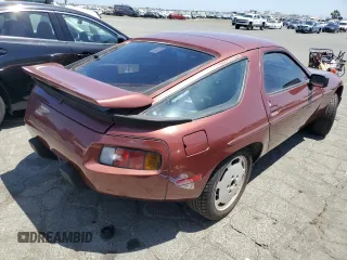 1986 Porsche 928 z VIN WP0JB0924GS860517, wystawiony jako Copart lot #58575324 z przebiegiem 105 961 mil mil oraz Szkody całkowita. Historia ofert i sprzedaży dostępna na DreamBid. Obrazek 3.