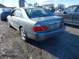 2003 Toyota Avalon XL with VIN 4T1BF28BX3U277269, listed as a IAAI auction lot 41589582 with 129,895 mi miles. Bid and sale history available at carsss.com. Image 3.