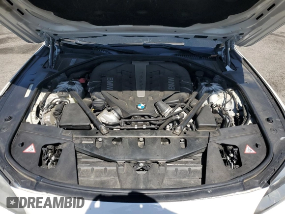 2013 BMW 7 Series 750i with VIN WBAYA8C54DC996412, listed as a Copart auction lot 56982895 with 124,258 mi miles and Salvage title. Bid and sale history available at DreamBid. Image 11.