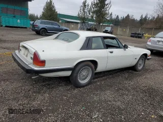 1989 Jaguar XJS z VIN SAJNA5840KC150684, wystawiony jako Copart lot #48081805 z przebiegiem 93 444 mil mil oraz Czysty tytuł • Clean title. Historia ofert i sprzedaży dostępna na DreamBid. Obrazek 3.