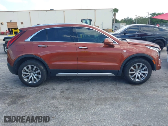 2019 Cadillac XT4 FWD Premium Luxury z VIN 1GYFZCR41KF183507, wystawiony jako IAAI lot #41987176 z przebiegiem 64 803 mil mil oraz . Historia ofert i sprzedaży dostępna na DreamBid. Obrazek 13.