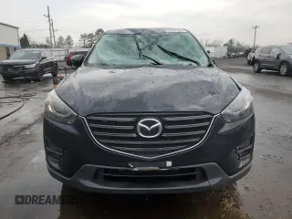 2016 Mazda CX-5 Grand Touring with VIN JM3KE4DYXG0711367, listed as a Copart auction lot 52862405 with 87,870 mi miles and Salvage Title. Bid and sale history available at DreamBid. Image 5.