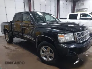 2008 Dodge Dakota Laramie with VIN 1D7HW58N58S613946, listed as a IAAI auction lot 41598426 with 114,272 mi miles. Bid and sale history available at carsss.com. Image 1.
