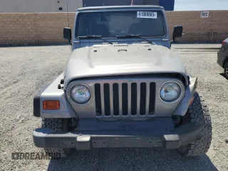 2000 Jeep Wrangler SE with VIN 1J4FA29P7YP737289, listed as a Copart auction lot 61869865 with 91,097 mi miles and Salvage title. Bid and sale history available at DreamBid. Image 5.
