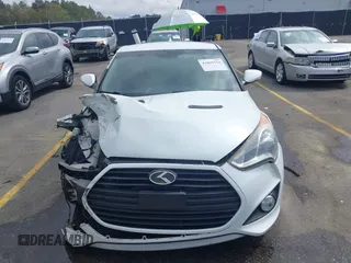 2013 Hyundai Veloster Turbo z VIN KMHTC6AE6DU112233, wystawiony jako IAAI lot #41869164 z przebiegiem 151 091 mil mil oraz . Historia ofert i sprzedaży dostępna na DreamBid. Obrazek 12.