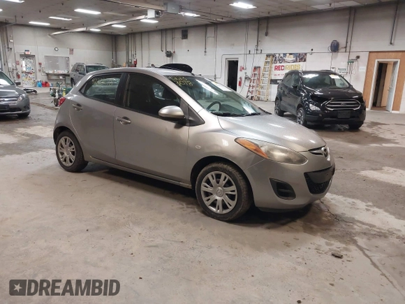 2012 Mazda 2 Sport with VIN JM1DE1KZ0C0149808, listed as a IAAI auction lot 42233078 with 166,111 mi miles and . Bid and sale history available at DreamBid. Image 1.