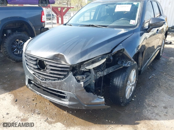 2016 Mazda CX-5 Touring with VIN JM3KE4CY3G0672977, listed as a IAAI auction lot 41889137 with 130,593 mi miles. Bid and sale history available at carsss.com. Image 6.