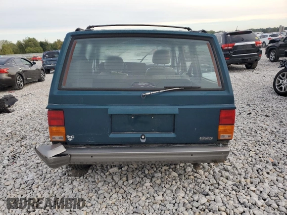 1996 Jeep Cherokee Country with VIN 1J4FJ78S7TL242853, listed as a Copart auction lot 73022554 with 84,868 mi miles and Salvage Title. Bid and sale history available at carsss.com. Image 6.