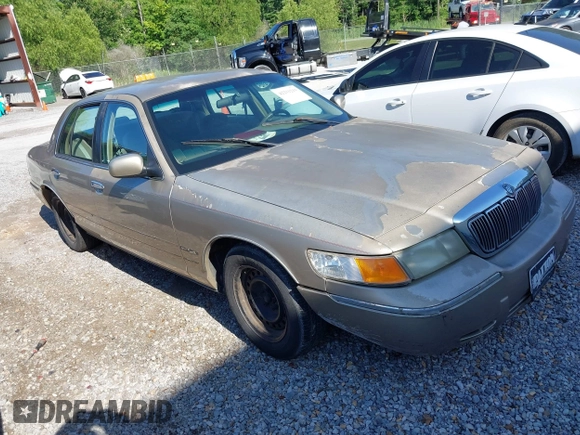 1999 Mercury Grand Marquis GS z VIN 2MEFM74W6XX626426, wystawiony jako IAAI lot #42231219 z przebiegiem 121 406 mil mil oraz . Historia ofert i sprzedaży dostępna na DreamBid. Obrazek 1.