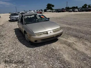 1998 Saturn SL z VIN 1G8ZK5271WZ265579, wystawiony jako Copart lot #68153934 z przebiegiem Nie podano mil oraz Szkoda całkowita • Salvage title. Historia ofert i sprzedaży dostępna na DreamBid. Obrazek 11.