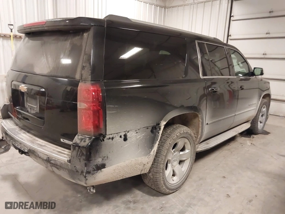 2017 Chevrolet Suburban Premier with VIN 1GNSKJKC0HR250854, listed as a IAAI auction lot 41541476 with 128,231 mi miles. Bid and sale history available at carsss.com. Image 4.