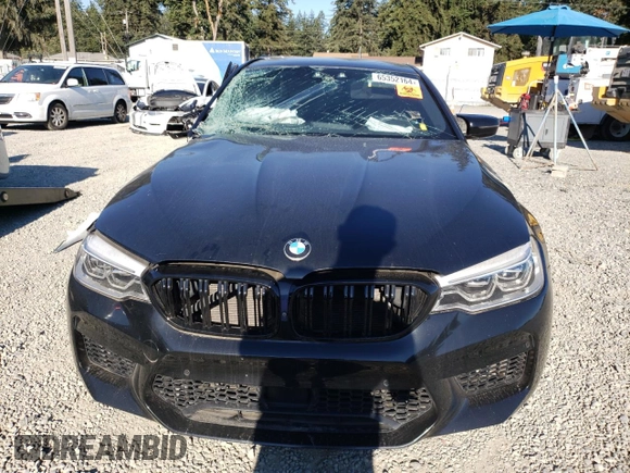 2018 BMW M5 z VIN WBSJF0C57JB283361, wystawiony jako Copart lot #65352164 z przebiegiem Nie podano mil oraz Szkoda całkowita • Salvage title. Historia ofert i sprzedaży dostępna na DreamBid. Obrazek 5.