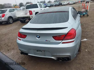 2014 BMW M6 z VIN WBS6C9C57ED467180, wystawiony jako IAAI lot #41461463 z przebiegiem 101 023 mil mil oraz . Historia ofert i sprzedaży dostępna na DreamBid. Obrazek 16.