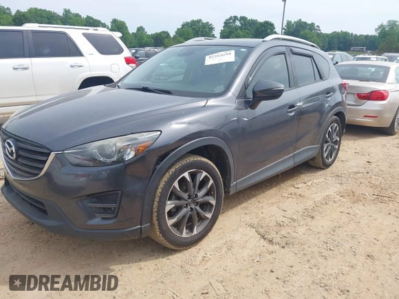 2016 Mazda CX-5 Grand Touring z VIN JM3KE2DY5G0801238, wystawiony jako IAAI lot #42264694 z przebiegiem 136 993 mil mil oraz . Historia ofert i sprzedaży dostępna na DreamBid. Obrazek 16.