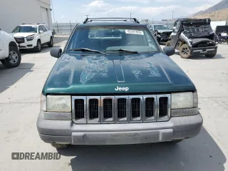 1996 Jeep Grand Cherokee Laredo z VIN 1J4GZ58S8TC222435, wystawiony jako Copart lot #62347665 z przebiegiem 202 125 mil mil oraz Czysty tytuł • Clean title. Historia ofert i sprzedaży dostępna na DreamBid. Obrazek 5.