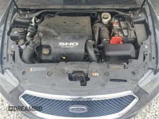 2016 Ford Taurus SHO z VIN 1FAHP2KTXGG155969, wystawiony jako Copart lot #54431405 z przebiegiem 124 040 mil mil oraz Szkoda całkowita • Salvage title. Historia ofert i sprzedaży dostępna na DreamBid. Obrazek 11.