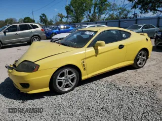 2006 Hyundai Tiburon GT z VIN KMHHN65F96U203308, wystawiony jako Copart lot #47278684 z przebiegiem 186 123 mil mil oraz Szkoda całkowita • Salvage title. Historia ofert i sprzedaży dostępna na DreamBid. Obrazek 1.