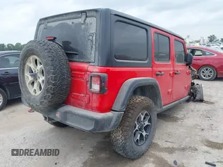 2021 Jeep Wrangler Unlimited Rubicon with VIN 1C4JJXFM1MW830218, listed as a IAAI auction lot 39934037 with Not provided miles and . Bid and sale history available at DreamBid. Image 4.