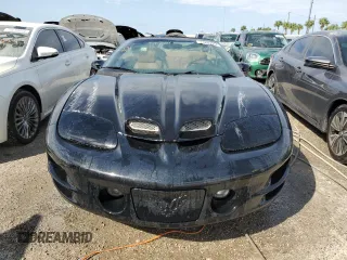 2001 Pontiac Firebird Trans Am z VIN 2G2FV32G812134704, wystawiony jako Copart lot #74893594 z przebiegiem Nie podano mil oraz Nie do naprawy • Non repairable. Historia ofert i sprzedaży dostępna na DreamBid. Obrazek 5.