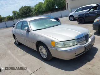 1999 Lincoln Town Car Signature with VIN 1LNHM82W5XY699589, listed as a IAAI auction lot 42613200 with 318,985 mi miles and . Bid and sale history available at DreamBid. Image 1.