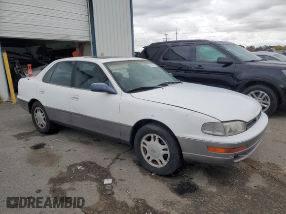 1994 Toyota Camry XLE with VIN JT2GK13E5R0008509, listed as a Copart auction lot 76014164 with 188,427 mi miles and Salvage Title. Bid and sale history available at carsss.com. Image 4.