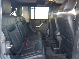 2014 Jeep Wrangler Unlimited Rubicon with VIN 1C4HJWFG9EL199501, listed as a Copart auction lot 61443595 with 86,940 mi miles and Salvage title. Bid and sale history available at DreamBid. Image 10.