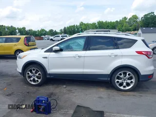 2016 Ford Escape Titanium with VIN 1FMCU9J90GUC48346, listed as a IAAI auction lot 42523307 with 114,265 mi miles and . Bid and sale history available at DreamBid. Image 14.