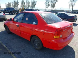 2003 Hyundai Accent GL with VIN KMHCG45C93U487209, listed as a IAAI auction lot 41590636 with 118,811 mi miles. Bid and sale history available at carsss.com. Image 3.