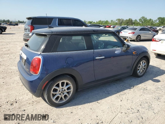 2014 MINI Hardtop with VIN WMWXM5C59ET972044, listed as a Copart auction lot 52519775 with 91,490 mi miles and Clean Title. Bid and sale history available at DreamBid. Image 3.