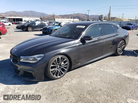 2019 BMW 7 Series 750i with VIN WBA7F0C56KGM25430, listed as a Copart auction lot 42048135 with 74,717 mi miles and Salvage title. Bid and sale history available at DreamBid. Image 1.