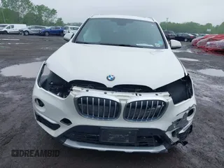 2018 BMW X1 xDrive28i with VIN WBXHT3C38J5L31322, listed as a IAAI auction lot 42260190 with 70,266 mi miles and . Bid and sale history available at DreamBid. Image 12.