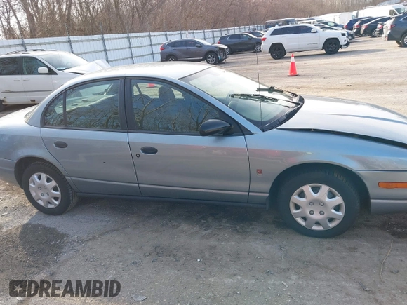 2002 Saturn SL z VIN 1G8ZH52892Z151119, wystawiony jako IAAI lot #41764757 z przebiegiem 82 017 mil mil oraz . Historia ofert i sprzedaży dostępna na DreamBid. Obrazek 13.