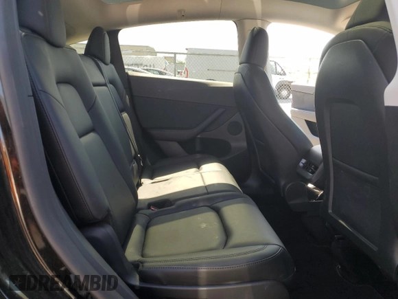 2023 Tesla Model Y Long Range z VIN 7SAYGAEE7PF859030, wystawiony jako Copart lot #58965185 z przebiegiem 18 421 mil mil oraz Czysty tytuł • Clean title. Historia ofert i sprzedaży dostępna na DreamBid. Obrazek 10.