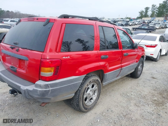 1999 Jeep Grand Cherokee Laredo with VIN 1J4GW58S0XC519908, listed as a IAAI auction lot 41789905 with 221,064 mi miles. Bid and sale history available at carsss.com. Image 4.