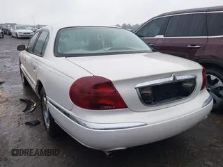 2001 Lincoln Continental with VIN 1LNHM97V51Y670610, listed as a IAAI auction lot 41439804 with 160,114 mi miles. Bid and sale history available at carsss.com. Image 3.