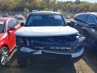 2023 Ford Bronco Sport Badlands z VIN 3FMCR9D93PRD33699, wystawiony jako IAAI lot #40632148 z przebiegiem 21 363 mil mil oraz . Historia ofert i sprzedaży dostępna na DreamBid. Obrazek 12.