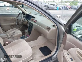 2001 Toyota Camry CE z VIN 4T1BG22K01U028448, wystawiony jako IAAI lot #42324384 z przebiegiem 190 325 mil mil oraz . Historia ofert i sprzedaży dostępna na DreamBid. Obrazek 5.