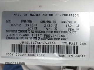 2012 Mazda Mazda3 i Touring with VIN JM1BL1V74C1694444, listed as a IAAI auction lot 41879335 with 123,020 mi miles. Bid and sale history available at carsss.com. Image 9.