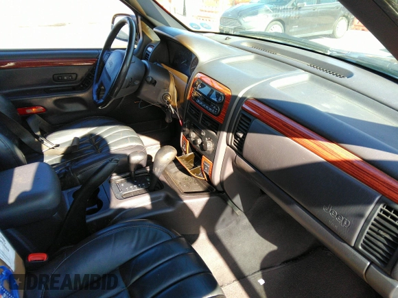 1999 Jeep Grand Cherokee Limited with VIN 1J4GW68N8XC770305, listed as a IAAI auction lot 41720558 with 206,180 mi miles. Bid and sale history available at carsss.com. Image 5.