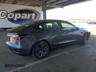 2023 Tesla Model 3 with VIN 5YJ3E1EA4PF456228, listed as a Copart auction lot 61442085 with 121,173 mi miles and Clean title. Bid and sale history available at DreamBid. Image 3.