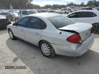 2003 Ford Taurus LX Standard z VIN 1FAFP52U43A110444, wystawiony jako Copart lot #83557764 z przebiegiem 118 897 mil mil oraz Szkoda całkowita • Salvage title. Historia ofert i sprzedaży dostępna na DreamBid. Obrazek 2.