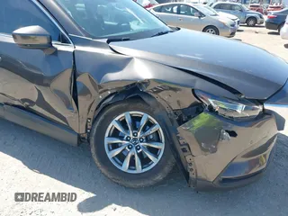 2019 Mazda CX-9 Touring with VIN JM3TCACY9K0304899, listed as a IAAI auction lot 42167180 with 57,043 mi miles and . Bid and sale history available at DreamBid. Image 6.