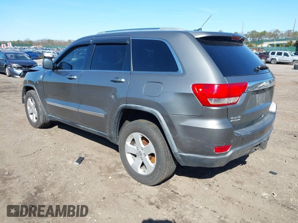 2012 Jeep Grand Cherokee Laredo with VIN 1C4RJFAG0CC145061, listed as a IAAI auction lot 41820140 with 185,015 mi miles. Bid and sale history available at carsss.com. Image 3.