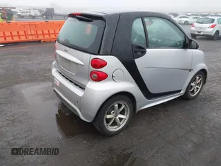 2015 Smart fortwo Passion with VIN WMEEJ3BA9FK819985, listed as a IAAI auction lot 41879486 with 79,394 mi miles. Bid and sale history available at carsss.com. Image 4.