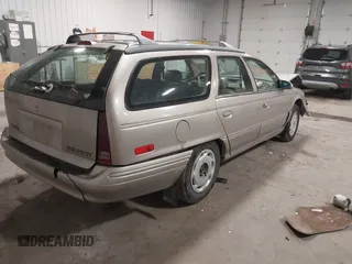 1994 Mercury Sable z VIN 1MELM5848RG607787, wystawiony jako IAAI lot #41938845 z przebiegiem 135 611 mil mil oraz . Historia ofert i sprzedaży dostępna na DreamBid. Obrazek 4.