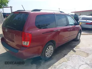 2014 Kia Sedona LX with VIN KNDMG4C71E6564595, listed as a IAAI auction lot 42015687 with 208,270 mi miles. Bid and sale history available at carsss.com. Image 4.