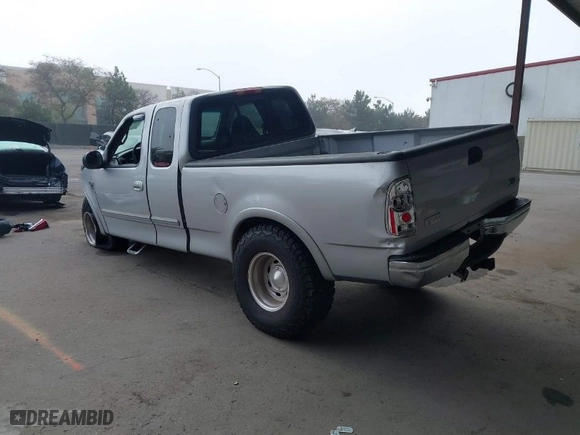2000 Ford F-150 XL with VIN 1FTRX18L9YKA05396, listed as a IAAI auction lot 41637310 with 234,555 mi miles. Bid and sale history available at carsss.com. Image 3.