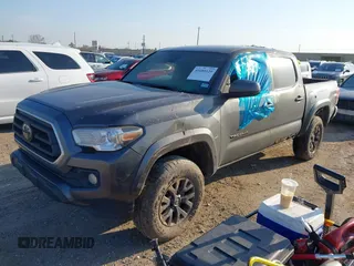 2021 Toyota Tacoma SR z VIN 5TFCZ5AN3MX272033, wystawiony jako IAAI lot #41689129 z przebiegiem Nie podano mil oraz . Historia ofert i sprzedaży dostępna na DreamBid. Obrazek 2.